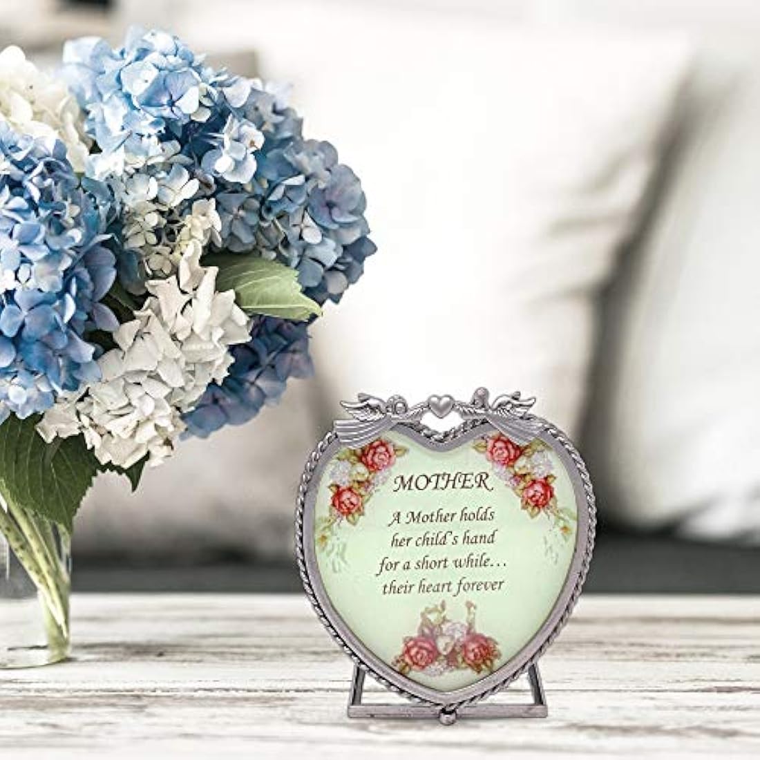 Corazón de vidrio Vela titular – A mother hold