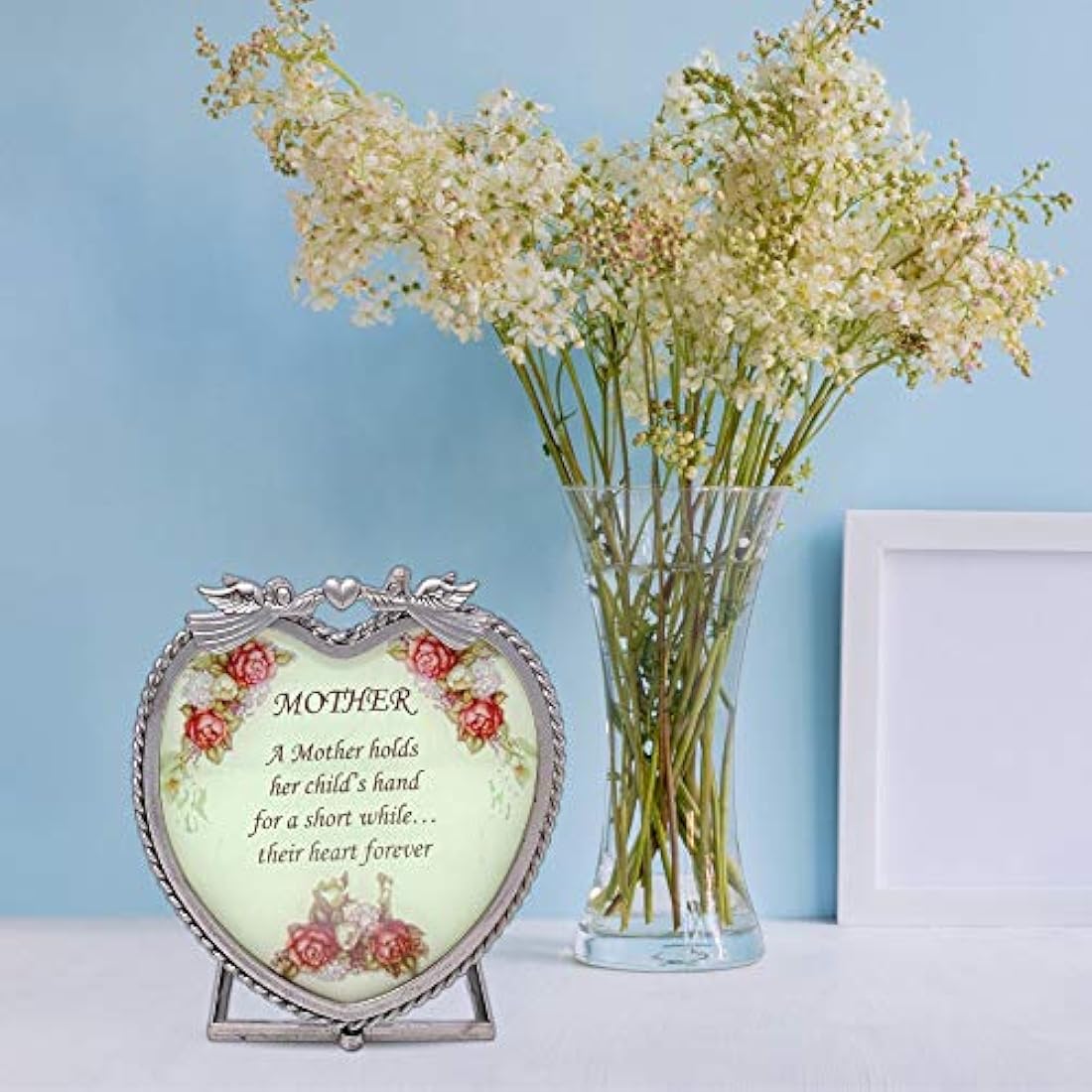 Corazón de vidrio Vela titular – A mother hold