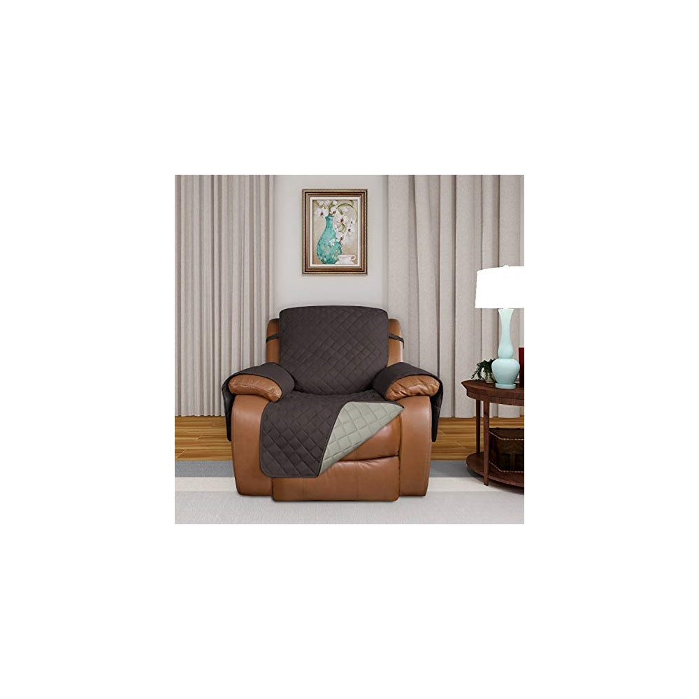 Funda acolchada reversible para sofá con correas elásticas.