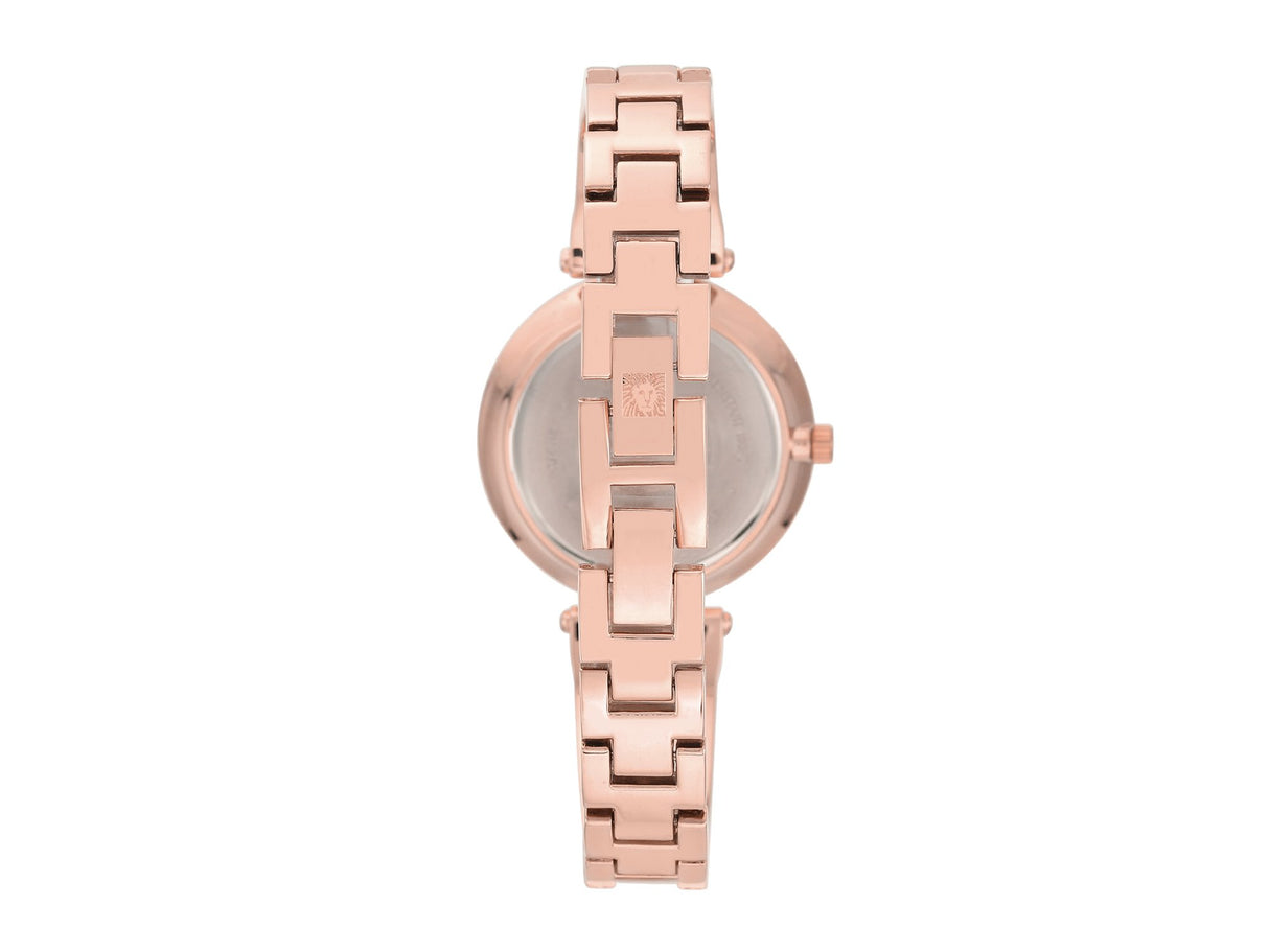 Reloj con brazalete marmoleado en tono dorado rosa