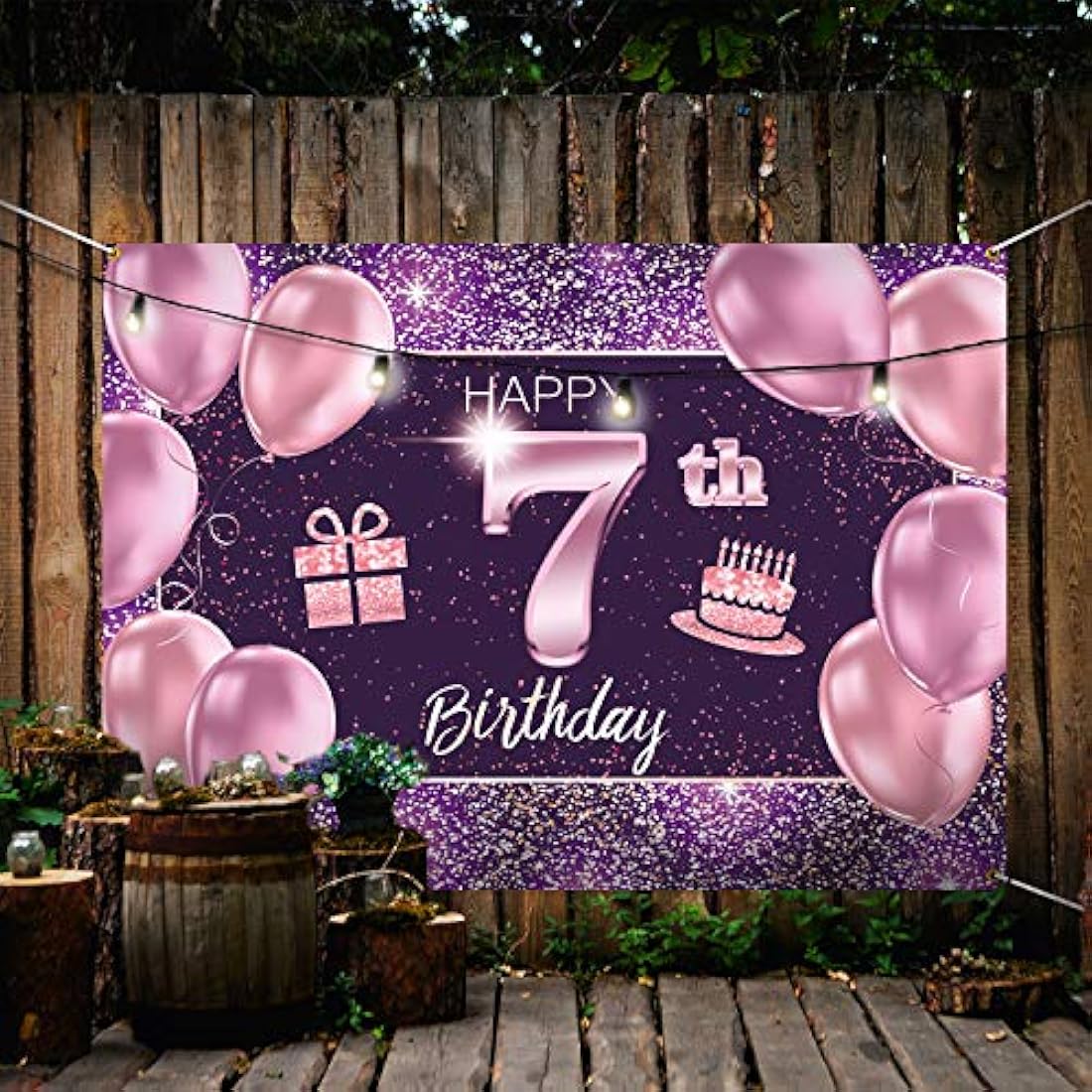 Pancarta rosa con texto en inglés “Happy Birthday”