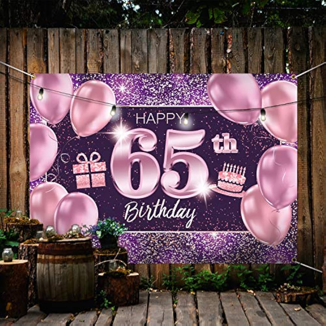 Pancarta grande rosa con texto en inglés “Happy Birthday”