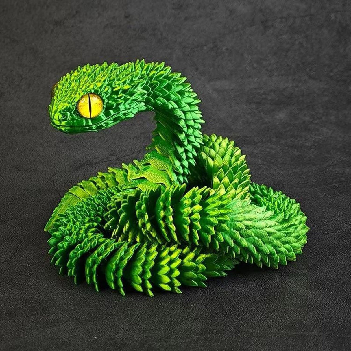 Juguete de serpiente impresa en 3D, flexible y articulada.