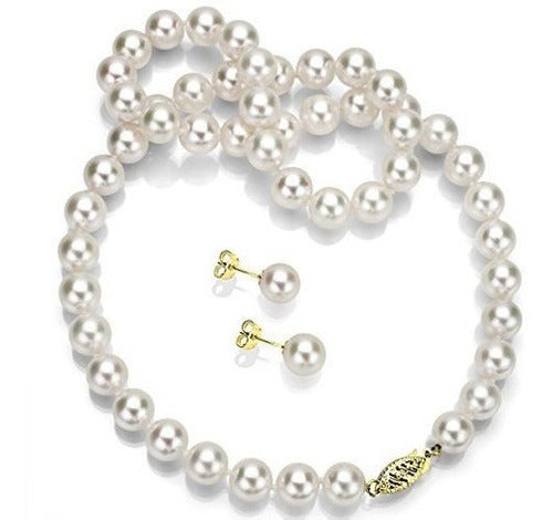 Conjunto de collar y pendientes de perlas y oro