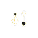 Aretes colgantes chapados en oro con forma de corazón