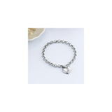 Pulseras de acero inoxidable y dije en forma de corazón
