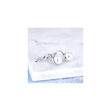 Aretes de perlas de agua dulce simuladas en pendientes