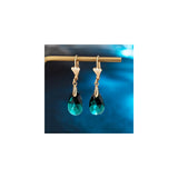 Aretes con dijes chapados en oro con forma de lágrima