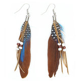 Pendientes de plumas lindos  hechos a mano