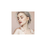 Aretes colgantes de oro de 18 quilates con perlas grandes