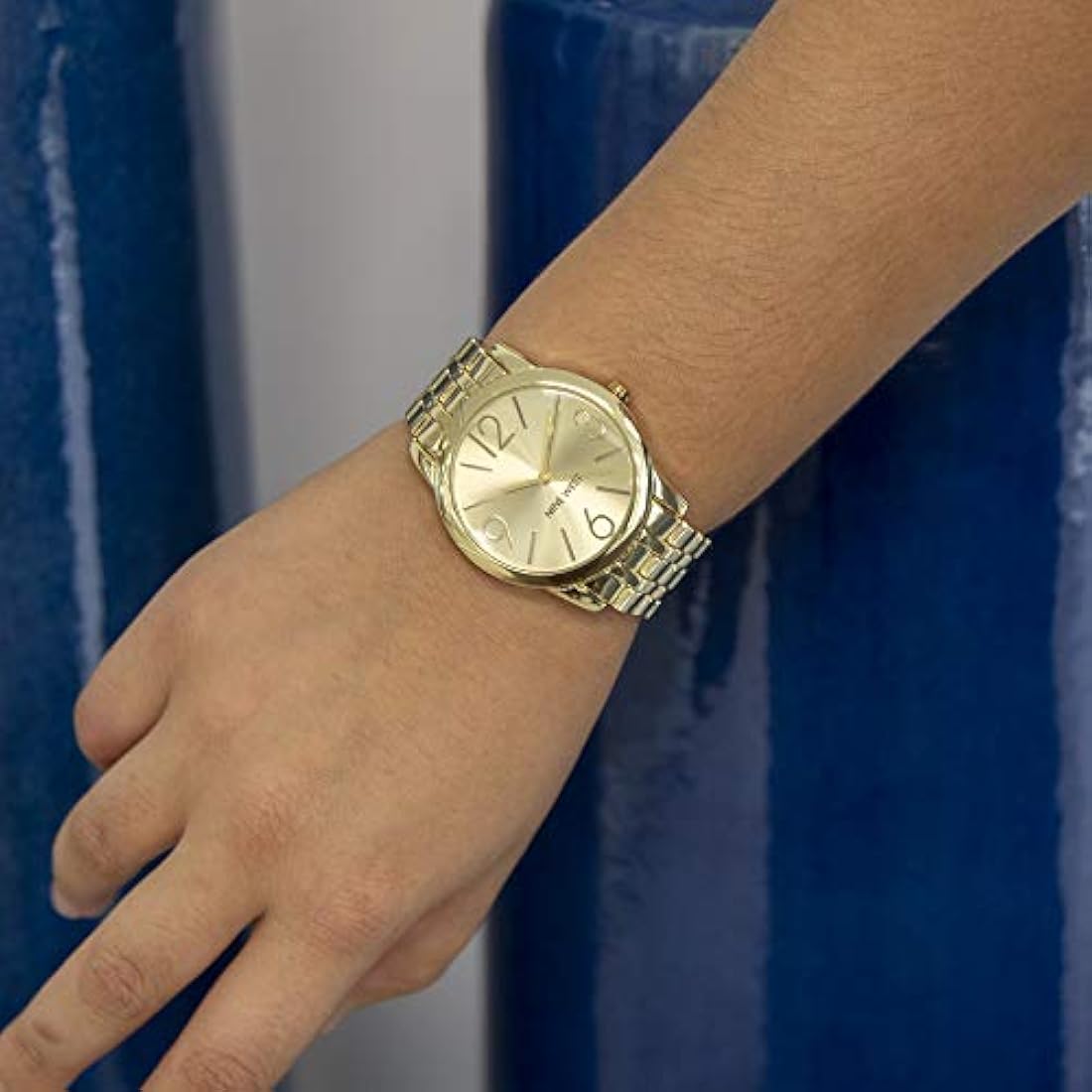 Reloj de pulsera con esfera de champagne Nine West