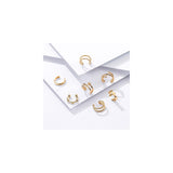 Aretes brillantes de oro con diseño de hélice