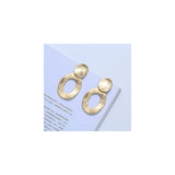 Aretes de clip geométricos de plata de oro mate