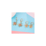 Aretes colgantes pequeños dorados con dije para mujeres