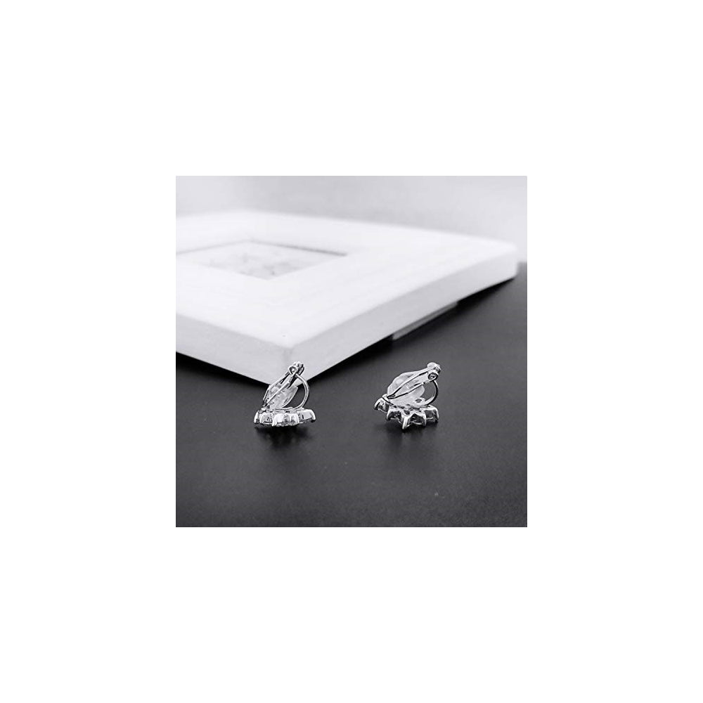 Aretes de clip con forma de copo de nieve para mujeres