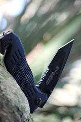 Cuchillo plegable, con traba, parcialmente aserrado