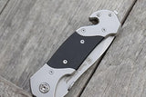 cuchillo plegable con traba, hoja parcialmente dentado