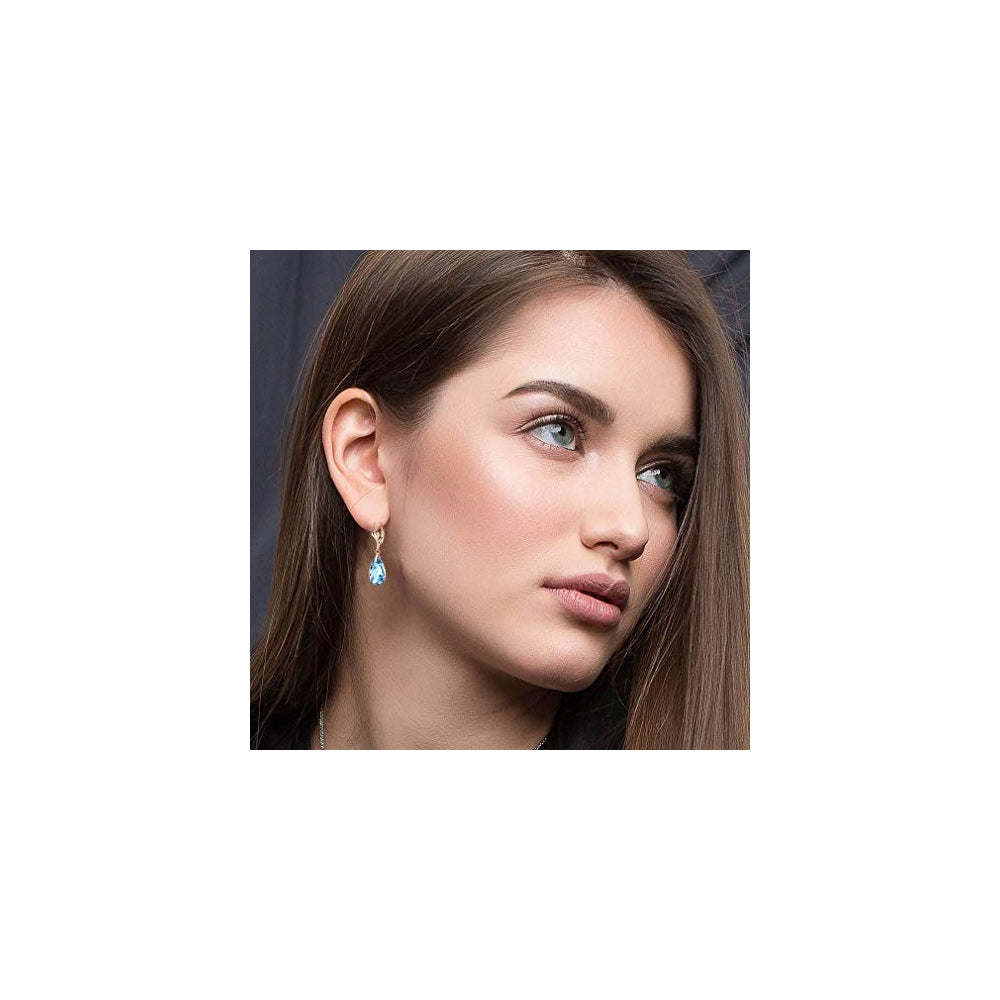 Aretes chapados en oro con dijes con forma de lágrima
