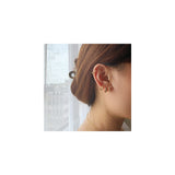 Aretes de aro con circonita brillante trenzada