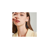 Aretes colgantes chapados en oro con forma de corazón