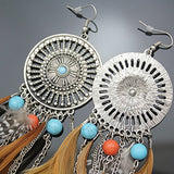 Pendientes en plata con plumas