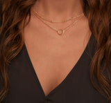 Collar con dije en forma de corazón en niveles delicado