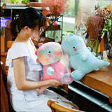 Peluches de dinosaurio rosado
