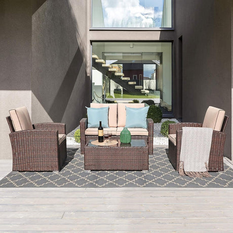 JOIVI Juego de muebles de patio, Juego de 4 piezas de conversación de patio al aire libre, Juego de sofá para patio, seccionado, para todo tipo de clima, de mimbre de ratán de polietileno, con mesa auxiliar de vidrio templado, Color Beige