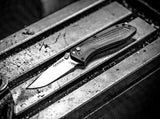 Cuchillo de transporte diario con apertura asistida
