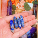 Juego de 10 varitas de cristales de sodalita azules y blancos