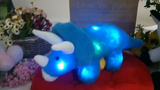 Dinosaurio de peluche con luz musical